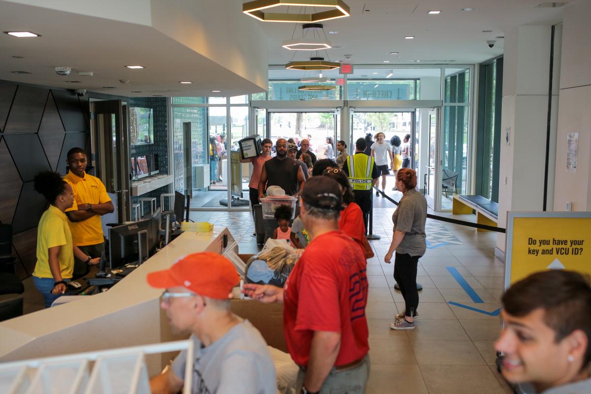 Students and family members enter Gladding Residence Center during freshman move-in day Saturday. 