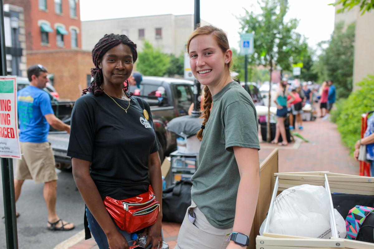 Anna Holzem, with the help of volunteer Patrice Branch, moves into the honors dorm