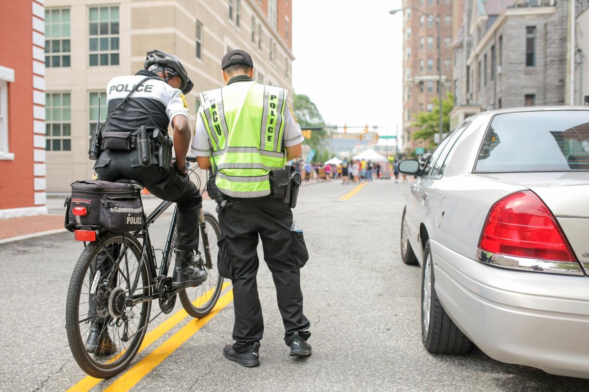 VCU Police officers stand on Laurel Street during freshman move-in on Saturday. 
