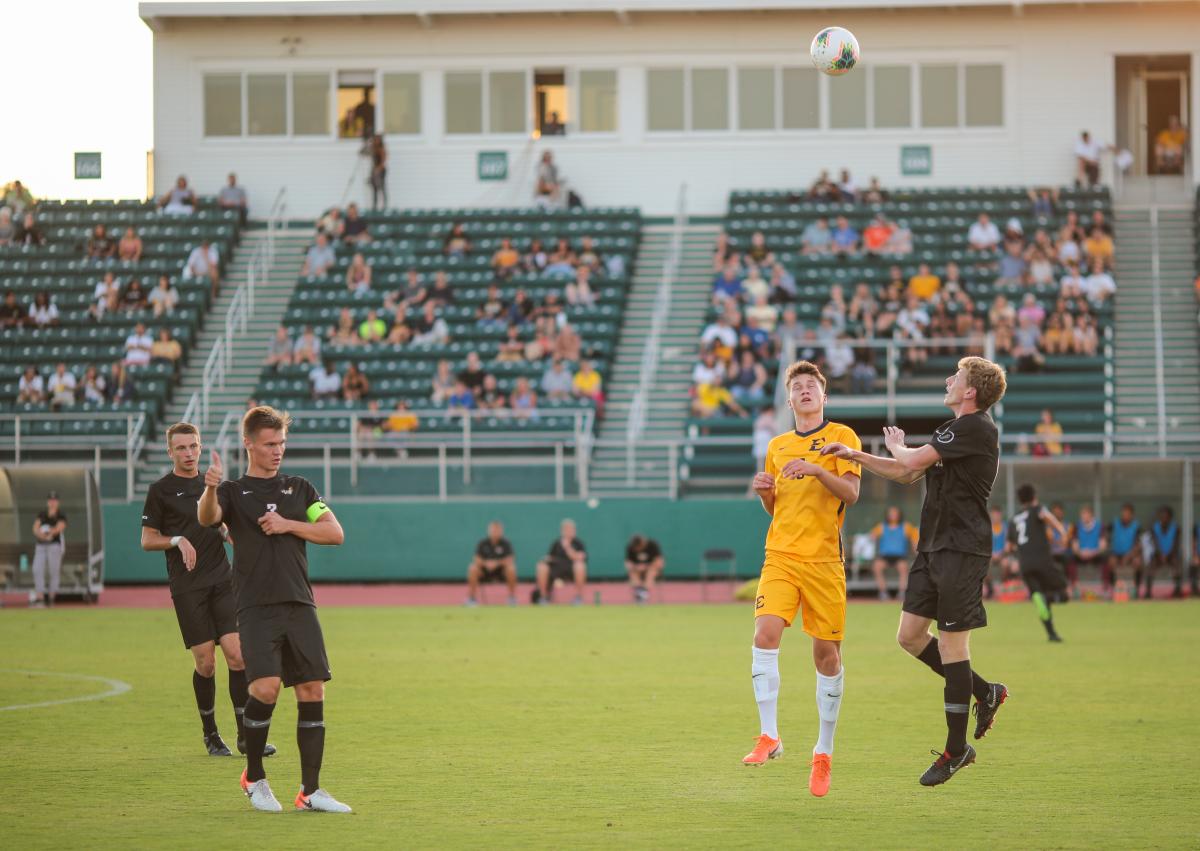 Redshirt-freshman defender Jared Valdes goes up for a header with an ETSU player. Photo by Jon Mirador