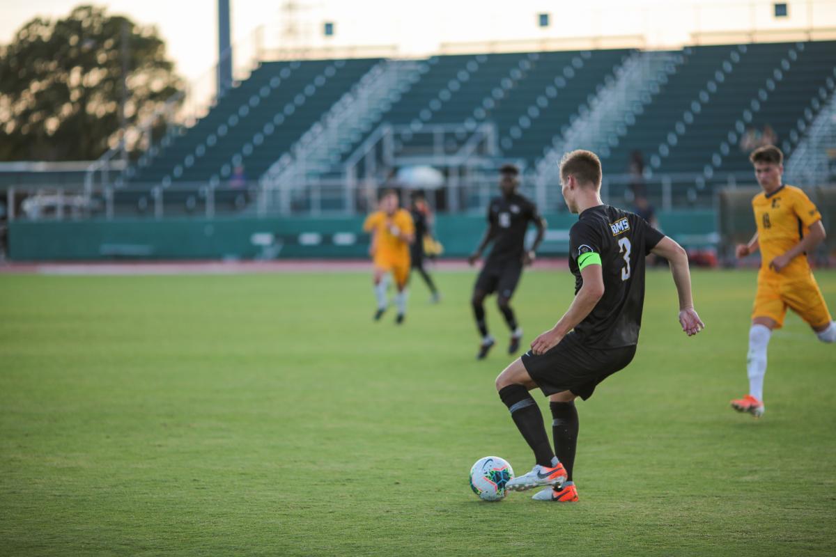 Junior defender Ulrik Edvardsen looks to pass against ETSU Aug. 30. Photo by Jon Mirador