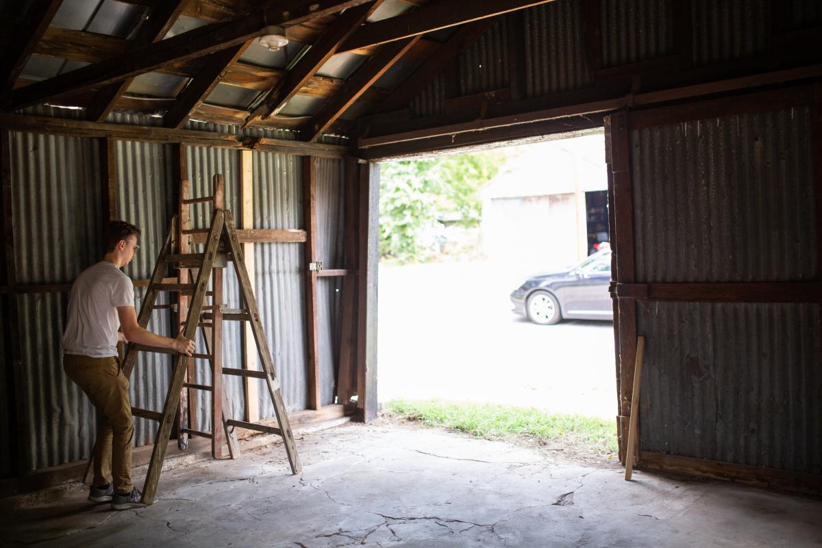 Friends helped Noah Hook and Kim Peters clean out the old backyard shed when they moved to the house in July. Photo by Jon Mirador