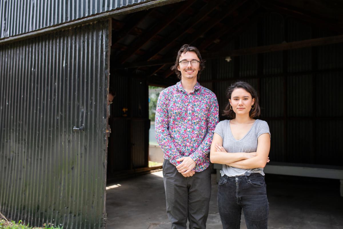 Noah Hook and Kim Peters stand in their backyard outside the shed that will soon become the Rump Gallery. Photo by Jon Mirador